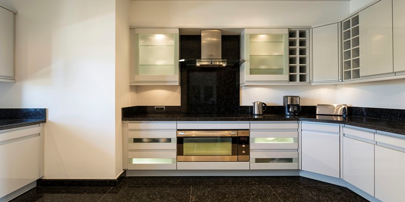 Modern Kitchen Featuring Stainless Steel Appliances And Custom Cabinetry