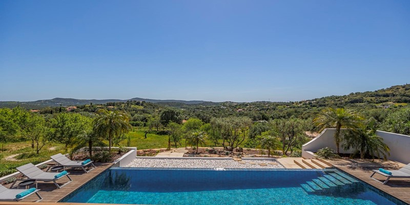 Stunning Views Of Pool And Garden For Serene Relaxation