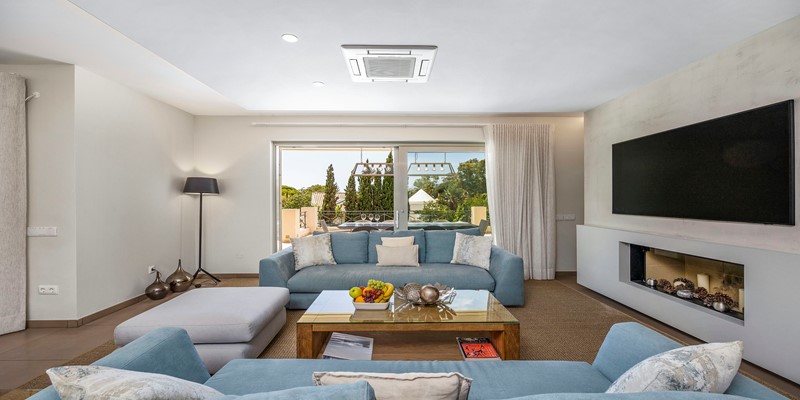 Unwind And Watch TV In The Comfortable Living Room