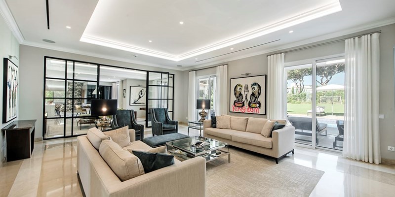 Modern Villa With Stylish Lounge Area And Sliding Doors To Outdoor Seating