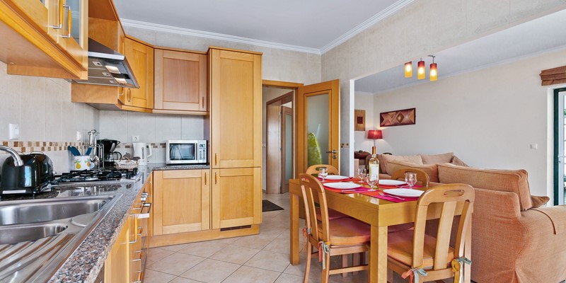 Fully Equipped Kitchen With Dining Area In Albufeira Apartment