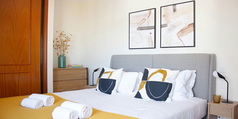 Bright Bedroom With City And Ocean Views