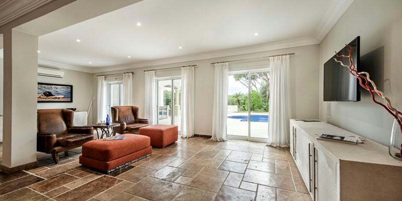 Spacious Living Room Modern Furnishings Pool View