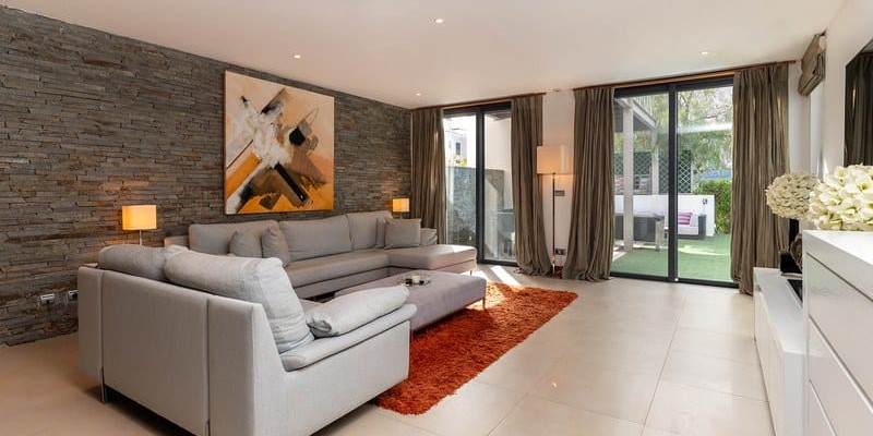 Living Room With Large TV And Poolside Access