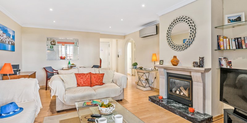 Cozy Living Room With Fireplace And Garden View