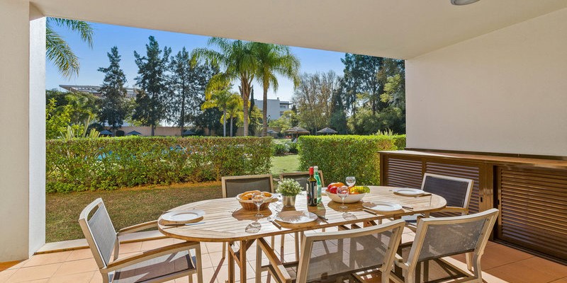 Modern Terrace With Outdoor Dining And Garden Views