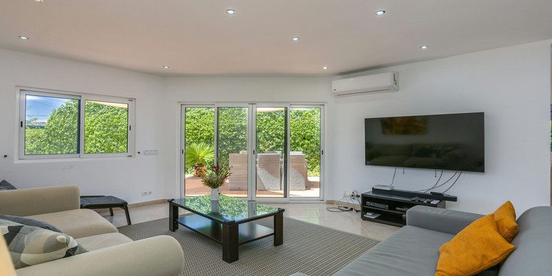 Villa With Comfortable Living Room And Patio Access