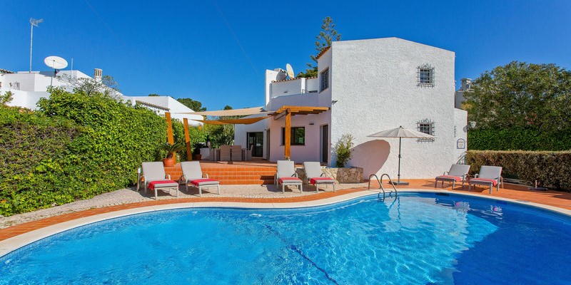 Swimming Pool With Sun Loungers And Shower