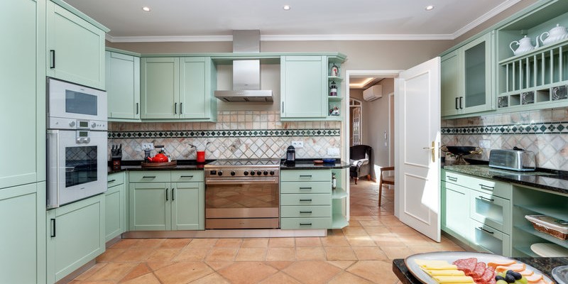 Spacious Luxury Villa Kitchen With Breakfast Bar And Appliances