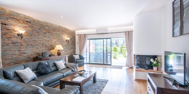 Modern Living Room With Access To Garden And Pool